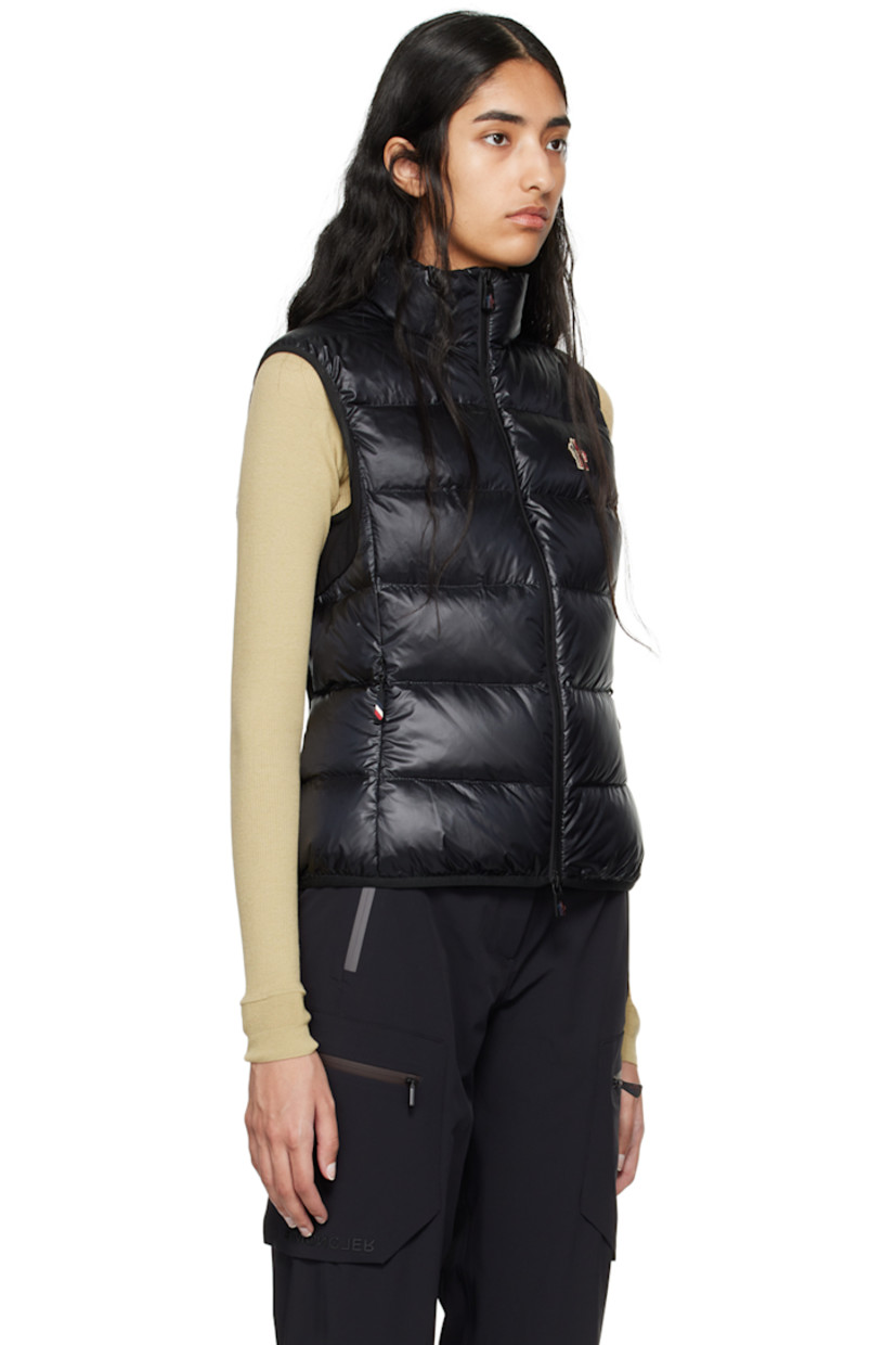 DIST-certified down-filled and quilted nylon ripstop and stretch nylon jersey vest. 

· Breathable, quick-drying, and moisture-wicking
· Paneled construction 
· Stand collar
· Zip closure
· Embroidered logo patch at chest
· Zip pockets
· Elasticized hem and armscyes 
· Text printed at back
· Partial mesh lining

Part of the Day-Namic collection.

Supplier color: Black

Fill: 90% goose down, 10% feather.