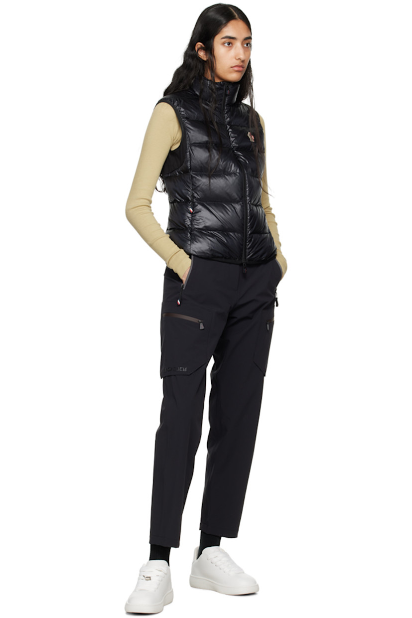 DIST-certified down-filled and quilted nylon ripstop and stretch nylon jersey vest. 

· Breathable, quick-drying, and moisture-wicking
· Paneled construction 
· Stand collar
· Zip closure
· Embroidered logo patch at chest
· Zip pockets
· Elasticized hem and armscyes 
· Text printed at back
· Partial mesh lining

Part of the Day-Namic collection.

Supplier color: Black

Fill: 90% goose down, 10% feather.