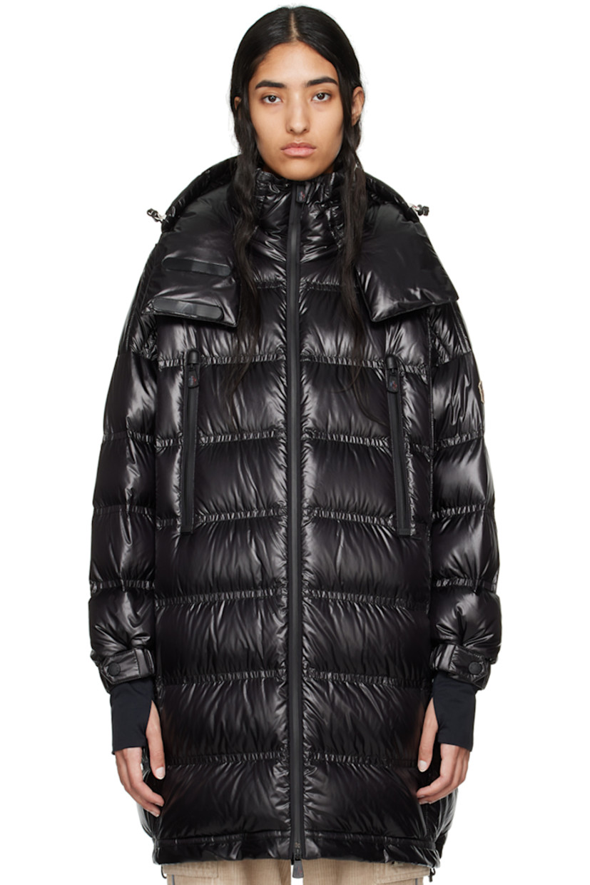 DIST-certified down-filled and quilted nylon laqué coat. Water-repellent, windproof, lightweight, and breathable. 

· Bungee-style drawstring at detachable hood
· Stand collar
· Two-way YKK® AquaGuard® zip closure
· Zip pockets
· Bungee-style drawstring at hem 
· Logo patch at sleeve
· Adjustable press-stud tab at elasticized cuffs
· Thumbhole at inset jersey cuffs
· Zip pocket at interior
· Fully lined 

Supplier color: Black

Fill: 90% goose down, 10% feather.