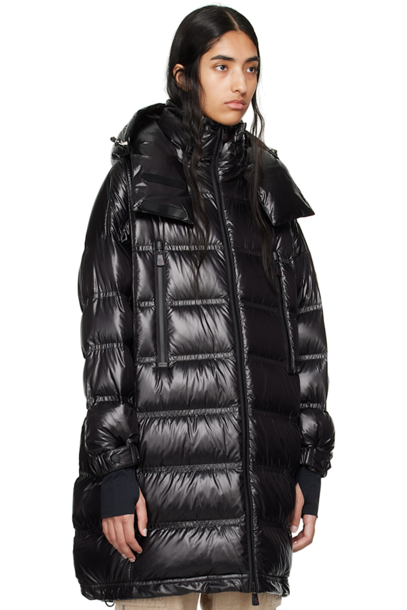 DIST-certified down-filled and quilted nylon laqué coat. Water-repellent, windproof, lightweight, and breathable. 

· Bungee-style drawstring at detachable hood
· Stand collar
· Two-way YKK® AquaGuard® zip closure
· Zip pockets
· Bungee-style drawstring at hem 
· Logo patch at sleeve
· Adjustable press-stud tab at elasticized cuffs
· Thumbhole at inset jersey cuffs
· Zip pocket at interior
· Fully lined 

Supplier color: Black

Fill: 90% goose down, 10% feather.