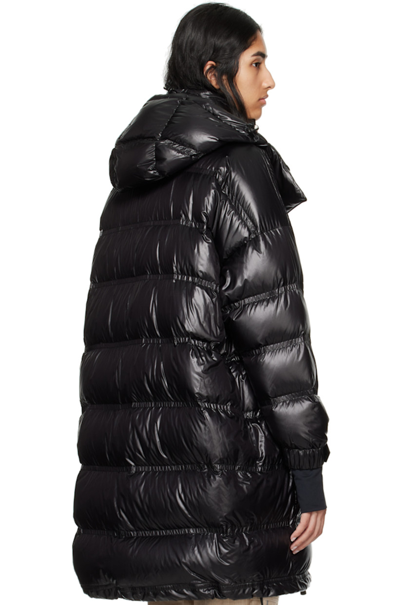 DIST-certified down-filled and quilted nylon laqué coat. Water-repellent, windproof, lightweight, and breathable. 

· Bungee-style drawstring at detachable hood
· Stand collar
· Two-way YKK® AquaGuard® zip closure
· Zip pockets
· Bungee-style drawstring at hem 
· Logo patch at sleeve
· Adjustable press-stud tab at elasticized cuffs
· Thumbhole at inset jersey cuffs
· Zip pocket at interior
· Fully lined 

Supplier color: Black

Fill: 90% goose down, 10% feather.
