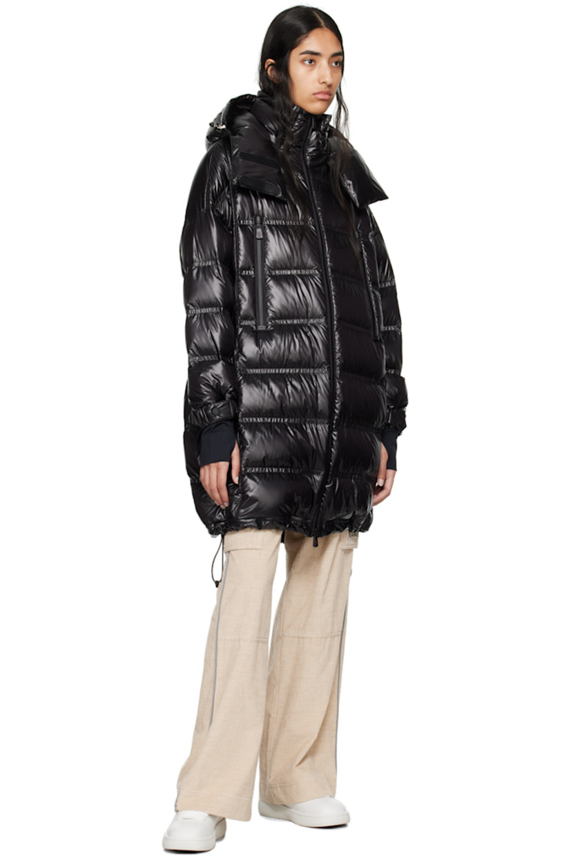 DIST-certified down-filled and quilted nylon laqué coat. Water-repellent, windproof, lightweight, and breathable. 

· Bungee-style drawstring at detachable hood
· Stand collar
· Two-way YKK® AquaGuard® zip closure
· Zip pockets
· Bungee-style drawstring at hem 
· Logo patch at sleeve
· Adjustable press-stud tab at elasticized cuffs
· Thumbhole at inset jersey cuffs
· Zip pocket at interior
· Fully lined 

Supplier color: Black

Fill: 90% goose down, 10% feather.