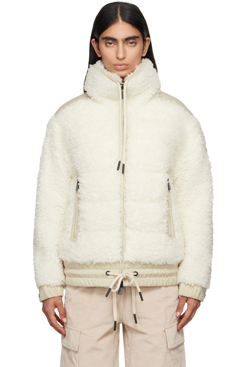 DIST-certified down-filled and quilted faux-shearling jacket.

· Paneled construction
· Drawstring at stand collar and hem
· Zip closure
· Zip pockets
· Elasticized hem 
· Embroidered logo patch at sleeve
· Adjustable press-stud fastening at elasticized cuffs
· Full nylon laqué lining

Supplier color: White 

Fill: 90% goose down, 10% feather.