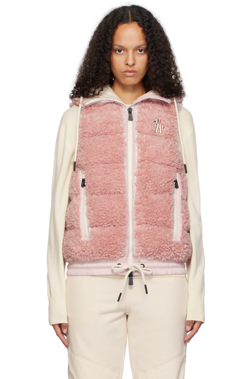 DIST-certified down-filled and quilted faux-shearling vest. Nylon laqué trim throughout. 

· Drawstring at hood 
· Two-way zip closure
· Embroidered logo patch at chest
· Zip pockets
· Drawstring at elasticized hem
· Elasticized armscyes
· Full nylon laqué lining

Supplier color: Pink

Fill: 90% goose down, 10% feather.