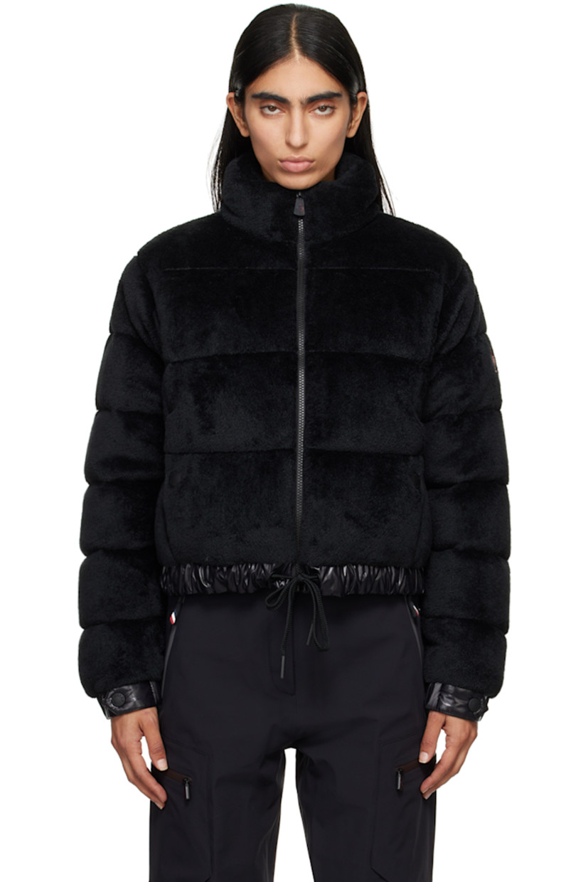 DIST-certified down-filled and quilted stretch faux-fur jacket. Breathable and lightweight. 

· Paneled construction
· Stand collar
· Zip closure
· Welt pockets
· Drawstring at elasticized hem 
· Embroidered logo patch at sleeve
· Adjustable press-stud fastening at elasticized cuffs
· Zip pocket at interior 
· Full nylon laqué lining

Supplier color: Black

Fill: 90% goose down, 10% feather.