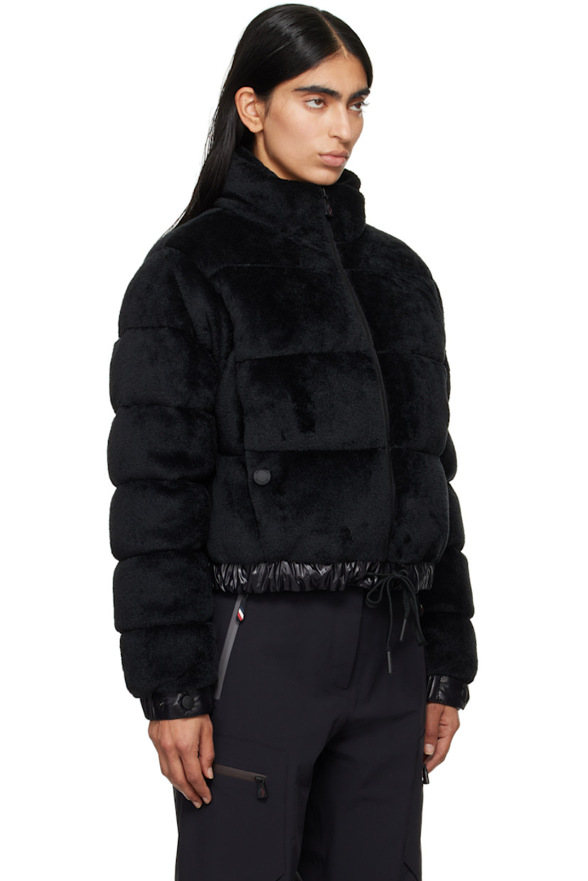 DIST-certified down-filled and quilted stretch faux-fur jacket. Breathable and lightweight. 

· Paneled construction
· Stand collar
· Zip closure
· Welt pockets
· Drawstring at elasticized hem 
· Embroidered logo patch at sleeve
· Adjustable press-stud fastening at elasticized cuffs
· Zip pocket at interior 
· Full nylon laqué lining

Supplier color: Black

Fill: 90% goose down, 10% feather.