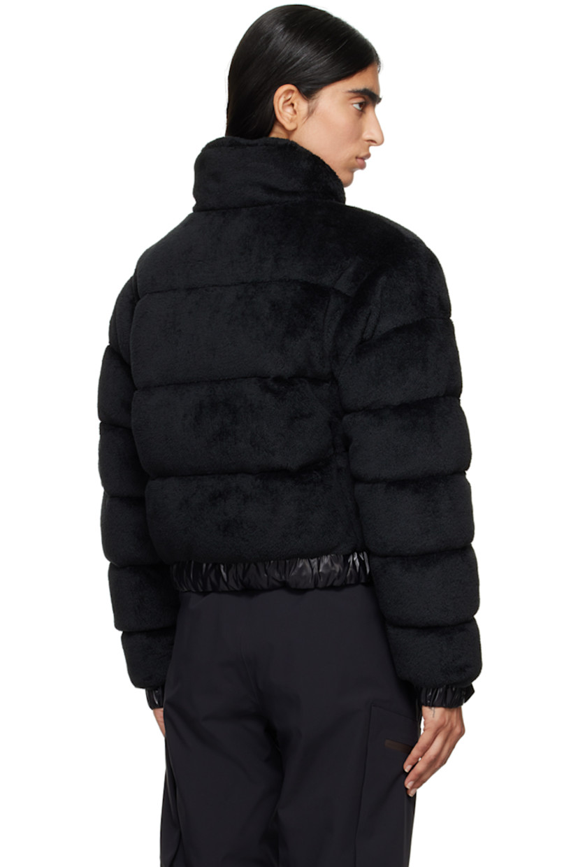 DIST-certified down-filled and quilted stretch faux-fur jacket. Breathable and lightweight. 

· Paneled construction
· Stand collar
· Zip closure
· Welt pockets
· Drawstring at elasticized hem 
· Embroidered logo patch at sleeve
· Adjustable press-stud fastening at elasticized cuffs
· Zip pocket at interior 
· Full nylon laqué lining

Supplier color: Black

Fill: 90% goose down, 10% feather.