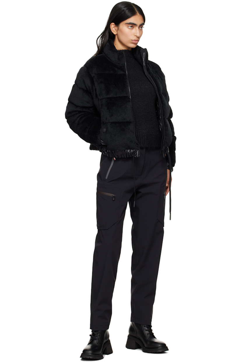 DIST-certified down-filled and quilted stretch faux-fur jacket. Breathable and lightweight. 

· Paneled construction
· Stand collar
· Zip closure
· Welt pockets
· Drawstring at elasticized hem 
· Embroidered logo patch at sleeve
· Adjustable press-stud fastening at elasticized cuffs
· Zip pocket at interior 
· Full nylon laqué lining

Supplier color: Black

Fill: 90% goose down, 10% feather.