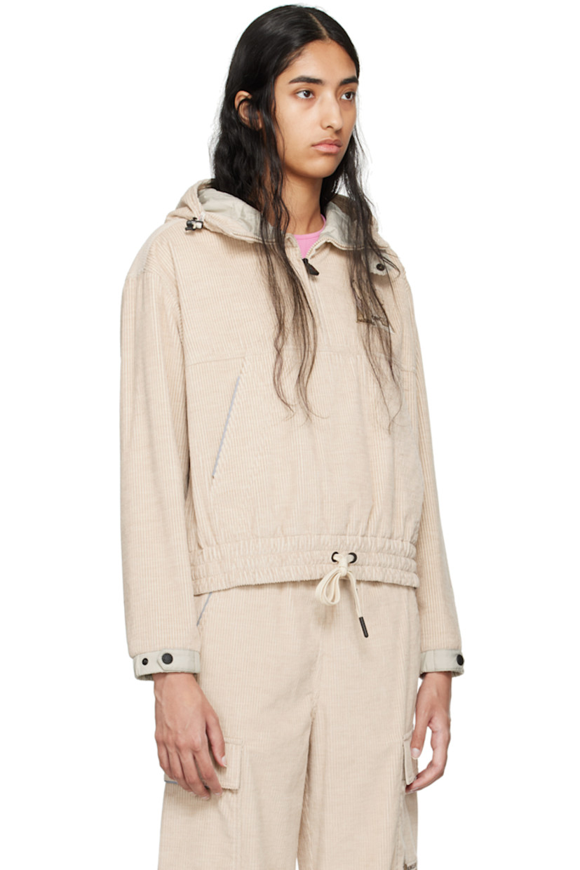 Breathable and lightweight cotton corduroy jacket. Reflective trim throughout.

· Bungee-style drawstring at elasticized hood 
· Stand collar
· Half-zip closure
· Bouclé logo patch at chest
· Kangaroo pocket
· Drawstring at elasticized hem
· Zip vent at side seams
· Adjustable press-stud tab at elasticized cuffs
· Storm flap and logo patch at back 
· Nylon taffeta lining

Supplier color: Pink