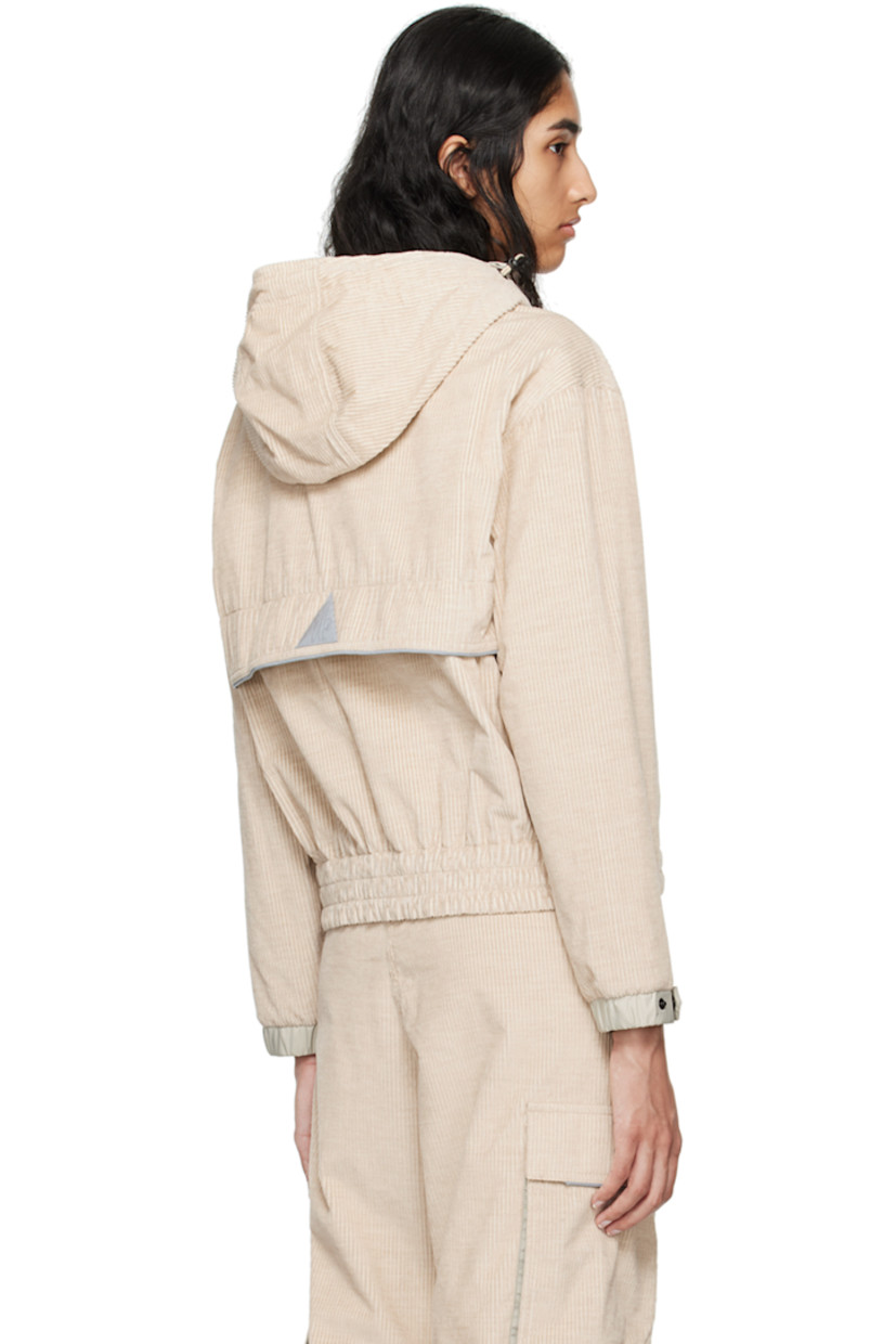 Breathable and lightweight cotton corduroy jacket. Reflective trim throughout.

· Bungee-style drawstring at elasticized hood 
· Stand collar
· Half-zip closure
· Bouclé logo patch at chest
· Kangaroo pocket
· Drawstring at elasticized hem
· Zip vent at side seams
· Adjustable press-stud tab at elasticized cuffs
· Storm flap and logo patch at back 
· Nylon taffeta lining

Supplier color: Pink