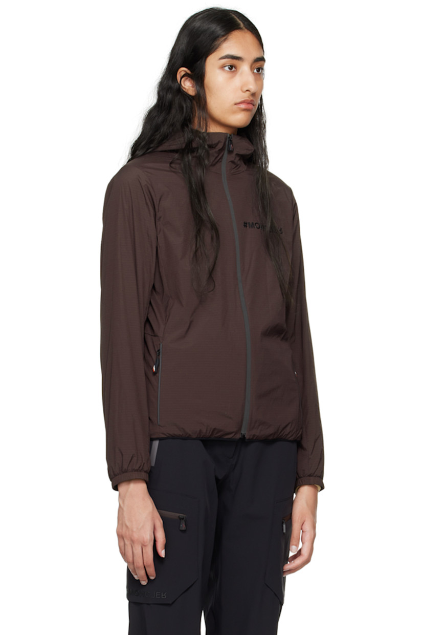 Packable stretch nylon ripstop jacket. Lightweight, breathable, water-repellent, and windproof. 

· Partially elasticized hood
· Stand collar
· Zip closure
· Logo bonded at chest
· Zip pockets
· Elasticized hem and cuffs
· Embroidered logo patch at sleeve
· Text printed at back hem
· Patch pocket at interior
· Full polyester mesh lining 

Part of the Day-Namic collection.

Supplier color: Dark brown