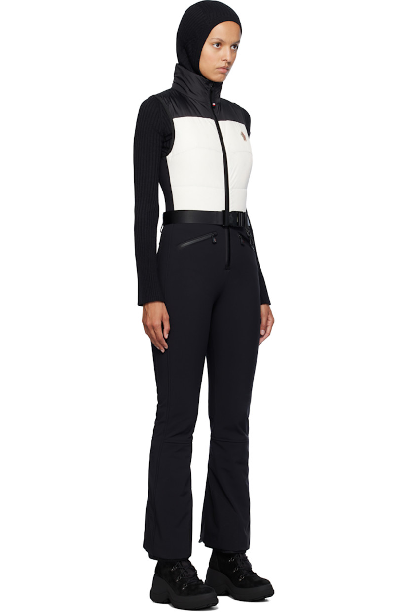 Down-filled and quilted stretch nylon taffeta jumpsuit. Water-repellent, windproof, and breathable.

· Funnel neck
· YKK® AquaGuard® zip closure
· Embroidered logo patch at chest
· Belt loops and press-release belt 
· Two-pocket styling
· Zip-fly
· Lanyard-clasp and press-stud pull loop at waist
· YKK® AquaGuard® zip vent at cuffs
· Elasticized powder cuffs
· Logo bonded at outseam
· Partial fleece lining

Supplier color: Black-White

Fill 1: 90% goose down, 10% feather.