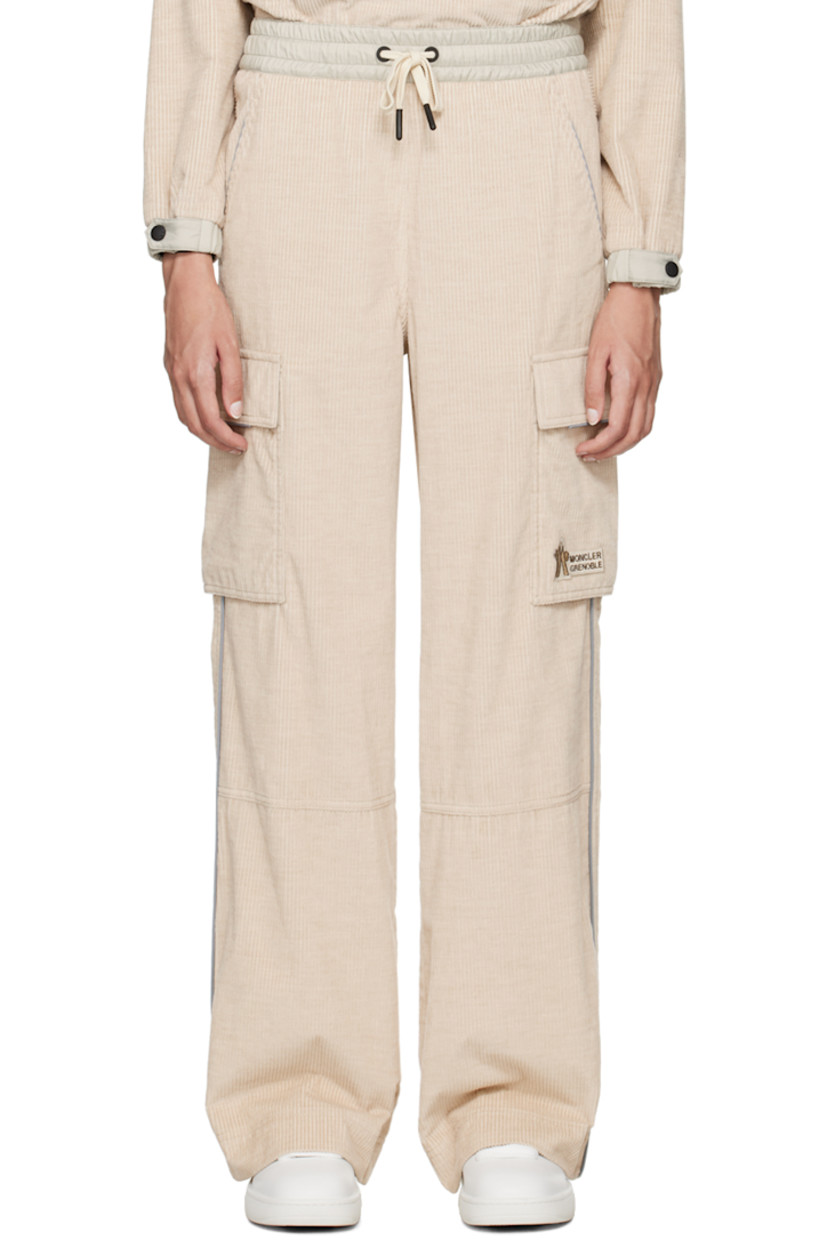 Lightweight and breathable cotton corduroy lounge pants. Reflective trim throughout. 

· Drawstring at elasticized waistband 
· Two pocket styling
· Logo patch at front
· Cargo pocket at outseams
· Locker loop at back waistband
· Logo flag at back 
· Partial nylon taffeta lining 

Supplier color: Pink