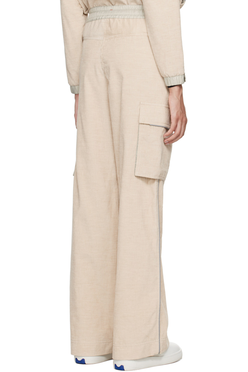 Lightweight and breathable cotton corduroy lounge pants. Reflective trim throughout. 

· Drawstring at elasticized waistband 
· Two pocket styling
· Logo patch at front
· Cargo pocket at outseams
· Locker loop at back waistband
· Logo flag at back 
· Partial nylon taffeta lining 

Supplier color: Pink