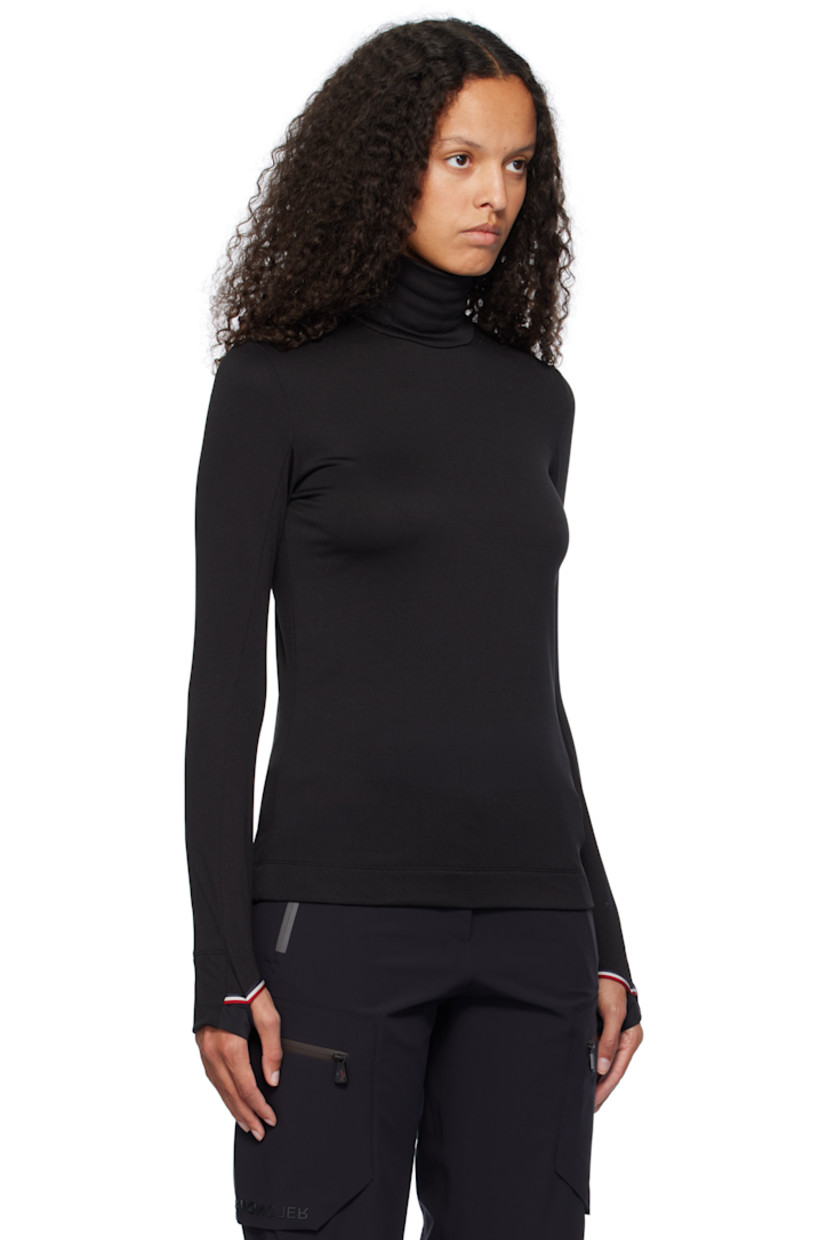 Lightweight Polartec® Power Grid ™ stretch polyester fleece turtleneck. Moisture-wicking and quick-drying.

· Slim-fit 
· Logo flag at side seam
· Rubberized logo patch at shoulder
· Tricolor grosgrain trim at cuffs and back collar 
· Thumbhole at cuffs

Supplier color: Black
