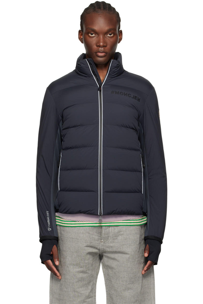 Primaloft®-insulated and DIST-certified down-filled quilted stretch nylon taffeta and stretch nylon interlock jersey jacket. Reflective trim throughout.

· Water-repellent, windproof, lightweight, and breathable
· Paneled construction
· Stand collar
· Two-way zip closure
· Rubberized logo at chest
· Zip pockets
· Elasticized trim at hem and cuffs 
· Embroidered logo patch at sleeve
· Text printed at cuff and back hem
· Thumbhole at inset stretch jersey cuffs
· Zip pocket at interior
· Partial stretch jersey lining
· Logo-engraved black hardware

Supplier color: Grey

Fill 1: 90% goose down, 10% goose feather.