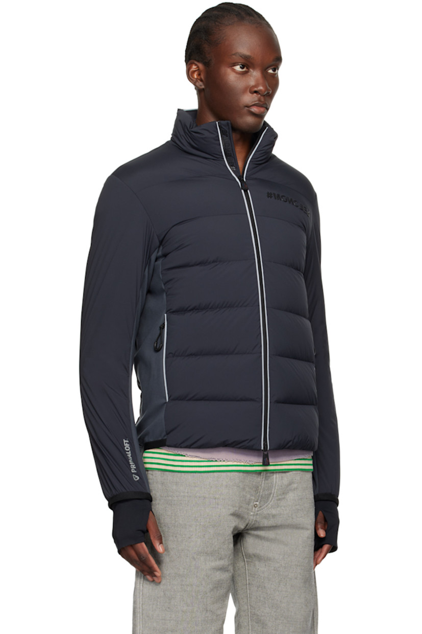 Primaloft®-insulated and DIST-certified down-filled quilted stretch nylon taffeta and stretch nylon interlock jersey jacket. Reflective trim throughout.

· Water-repellent, windproof, lightweight, and breathable
· Paneled construction
· Stand collar
· Two-way zip closure
· Rubberized logo at chest
· Zip pockets
· Elasticized trim at hem and cuffs 
· Embroidered logo patch at sleeve
· Text printed at cuff and back hem
· Thumbhole at inset stretch jersey cuffs
· Zip pocket at interior
· Partial stretch jersey lining
· Logo-engraved black hardware

Supplier color: Grey

Fill 1: 90% goose down, 10% goose feather.