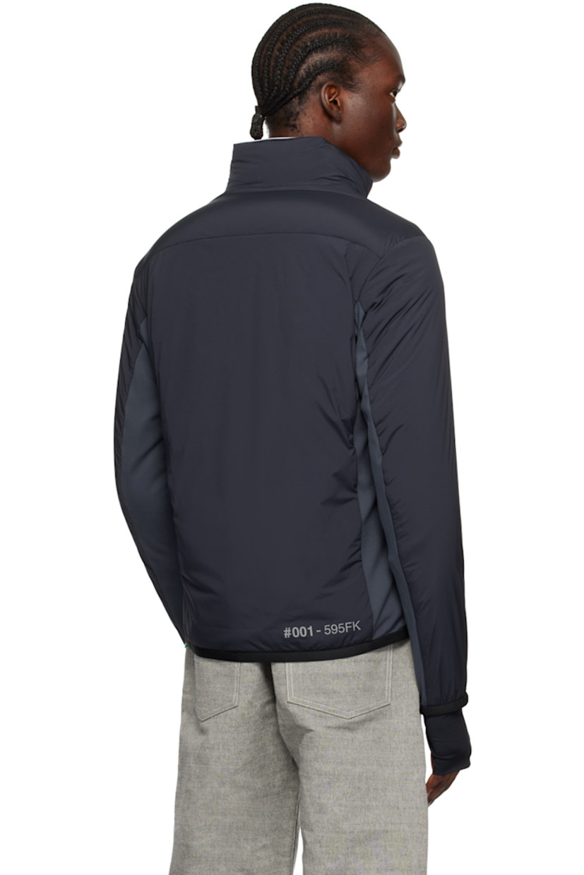 Primaloft®-insulated and DIST-certified down-filled quilted stretch nylon taffeta and stretch nylon interlock jersey jacket. Reflective trim throughout.

· Water-repellent, windproof, lightweight, and breathable
· Paneled construction
· Stand collar
· Two-way zip closure
· Rubberized logo at chest
· Zip pockets
· Elasticized trim at hem and cuffs 
· Embroidered logo patch at sleeve
· Text printed at cuff and back hem
· Thumbhole at inset stretch jersey cuffs
· Zip pocket at interior
· Partial stretch jersey lining
· Logo-engraved black hardware

Supplier color: Grey

Fill 1: 90% goose down, 10% goose feather.