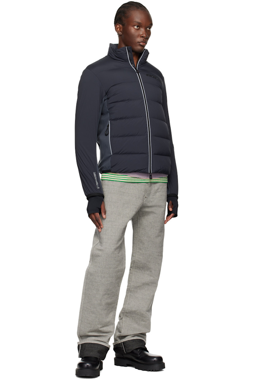 Primaloft®-insulated and DIST-certified down-filled quilted stretch nylon taffeta and stretch nylon interlock jersey jacket. Reflective trim throughout.

· Water-repellent, windproof, lightweight, and breathable
· Paneled construction
· Stand collar
· Two-way zip closure
· Rubberized logo at chest
· Zip pockets
· Elasticized trim at hem and cuffs 
· Embroidered logo patch at sleeve
· Text printed at cuff and back hem
· Thumbhole at inset stretch jersey cuffs
· Zip pocket at interior
· Partial stretch jersey lining
· Logo-engraved black hardware

Supplier color: Grey

Fill 1: 90% goose down, 10% goose feather.