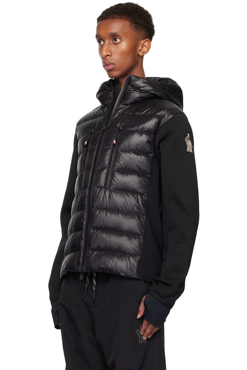 DIST-certified down-filled and quilted nylon laqué, polyester jersey, and knit stretch polyester-blend jacket. Breathable and lightweight.

· Paneled construction
· Webbing trim at hood
· Two-way zip closure
· Zip pockets
· Elasticized curved hem and cuffs
· Embroidered logo patch at sleeve 
· Thumbhole at inset jersey cuffs
· Partial ripstop and fleece lining

Part of the Après-Ski collection.

Supplier color: Black

Fill: 90% goose down, 10% feather.