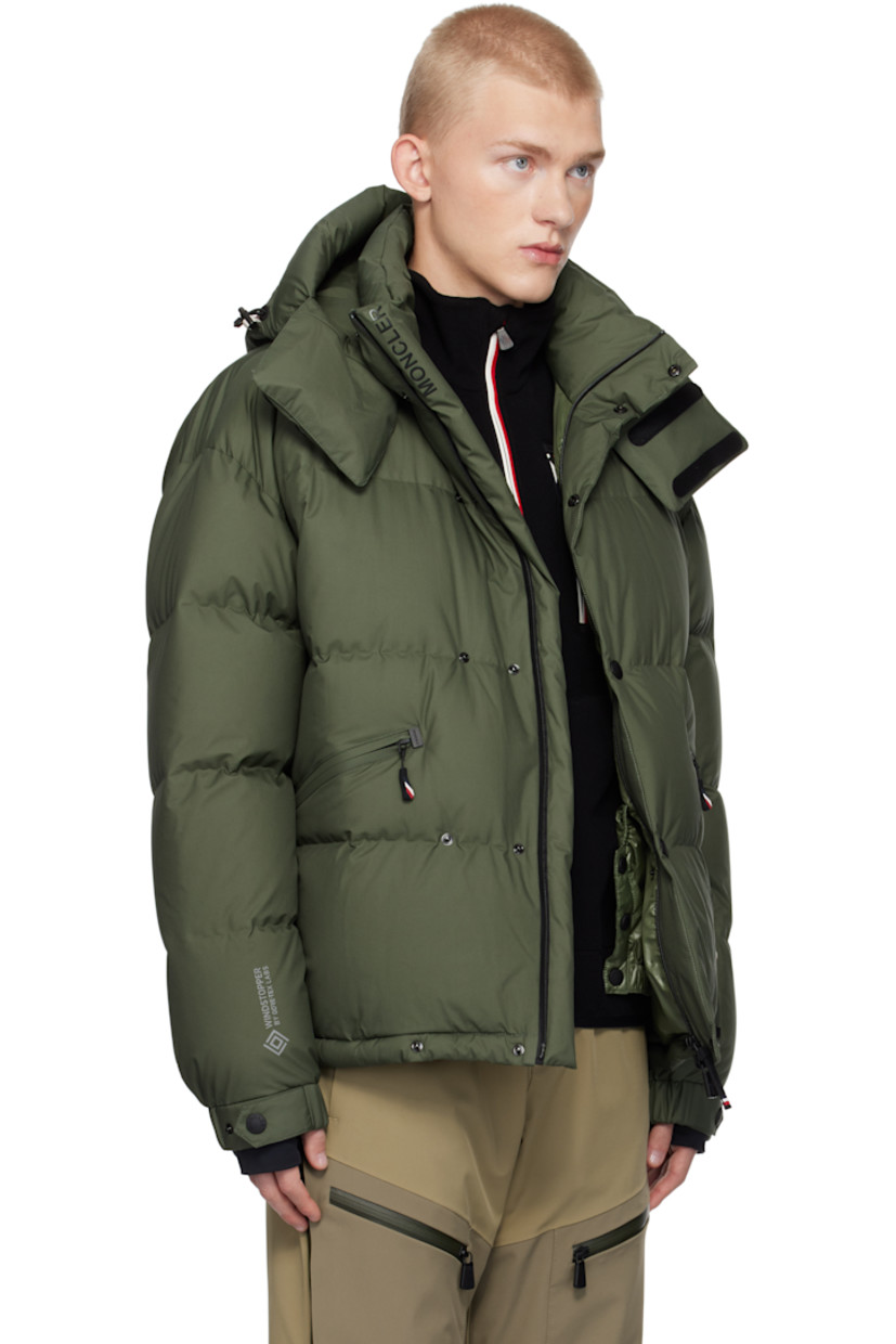 Down-filled and quilted nylon taffeta jacket. Windproof, water-repellent, lightweight, and breathable.

· Detachable hood
· Bungee-style drawstring and velcro tab at hood
· Two-way zip closure with press-stud placket
· Logo bonded at placket and sleeve
· Zip pockets
· Concealed bungee-style drawstring at hem
· Embroidered logo patch and zip pocket at sleeve
· Adjustable press-stud elasticized barrel cuffs
· Thumbhole at inset jersey cuffs
· Bonded text at back hem
· Zip pocket and snow skirt at interior
· Full ripstop lining

Supplier color: Green

Fill: 90% goose down, 10% goose feather.
