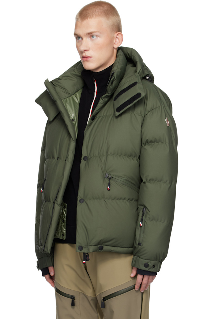 Down-filled and quilted nylon taffeta jacket. Windproof, water-repellent, lightweight, and breathable.

· Detachable hood
· Bungee-style drawstring and velcro tab at hood
· Two-way zip closure with press-stud placket
· Logo bonded at placket and sleeve
· Zip pockets
· Concealed bungee-style drawstring at hem
· Embroidered logo patch and zip pocket at sleeve
· Adjustable press-stud elasticized barrel cuffs
· Thumbhole at inset jersey cuffs
· Bonded text at back hem
· Zip pocket and snow skirt at interior
· Full ripstop lining

Supplier color: Green

Fill: 90% goose down, 10% goose feather.