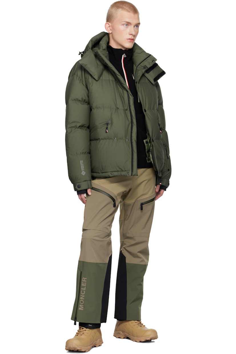 Down-filled and quilted nylon taffeta jacket. Windproof, water-repellent, lightweight, and breathable.

· Detachable hood
· Bungee-style drawstring and velcro tab at hood
· Two-way zip closure with press-stud placket
· Logo bonded at placket and sleeve
· Zip pockets
· Concealed bungee-style drawstring at hem
· Embroidered logo patch and zip pocket at sleeve
· Adjustable press-stud elasticized barrel cuffs
· Thumbhole at inset jersey cuffs
· Bonded text at back hem
· Zip pocket and snow skirt at interior
· Full ripstop lining

Supplier color: Green

Fill: 90% goose down, 10% goose feather.