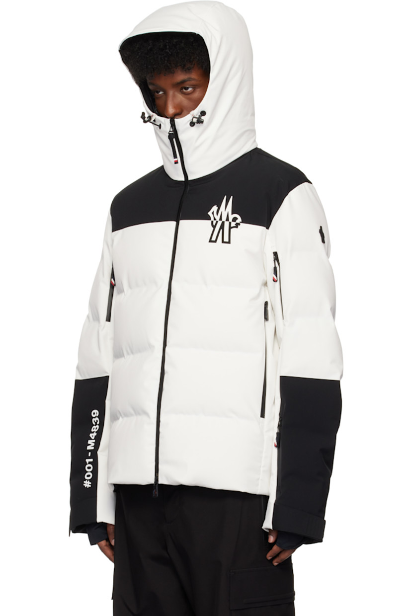 DIST-certified down-filled stretch polyester taffeta jacket. Waterproof, windproof, lightweight, and breathable.

· RECCO® rescue reflector
· Colorblock construction
· Bungee-style drawstring at hood
· Stand collar
· Two-way zip closure
· Logo bonded at chest and back
· Zip pockets
· Zip vent at sleeves
· Rubberized logo patch at sleeve
· Velcro tab at cuffs
· Thumbhole at inset jersey cuffs
· Zip pocket at interior
· Snow skirt at interior
· Full taffeta lining

Supplier color: Ice

Fill 1: 90% goose down, 10% feather.