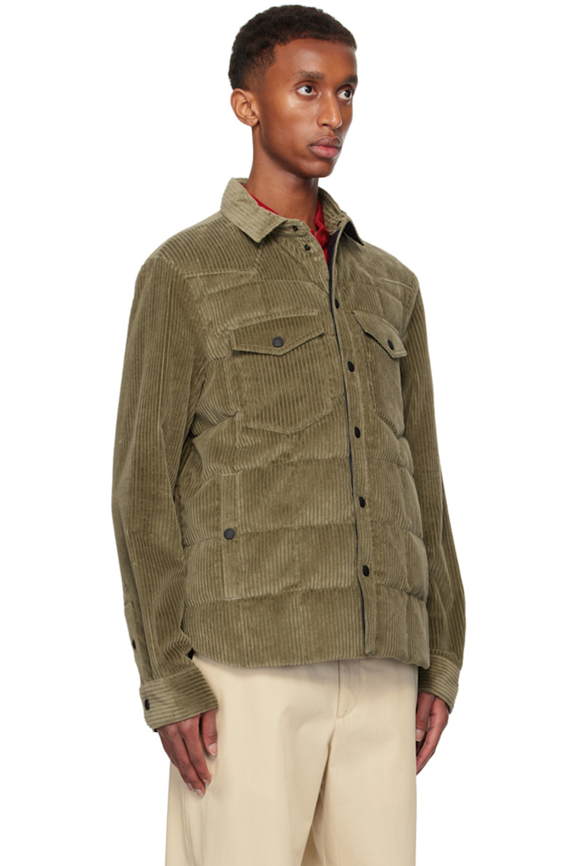 DIST-certified down-filled and quilted stretch cotton corduroy jacket. Breathable and lightweight.

· Spread collar 
· Press-stud closure
· Flap and welt pockets
· Shirttail hem
· Embroidered logo patch at sleeve
· Adjustable single-press-stud barrel cuffs
· Zip pocket at interior
· Full ripstop lining
· Logo-engraved black hardware

Part of the Après-Ski collection.

Supplier color: Military green

Fill 1: 90% goose down, 10% feather.