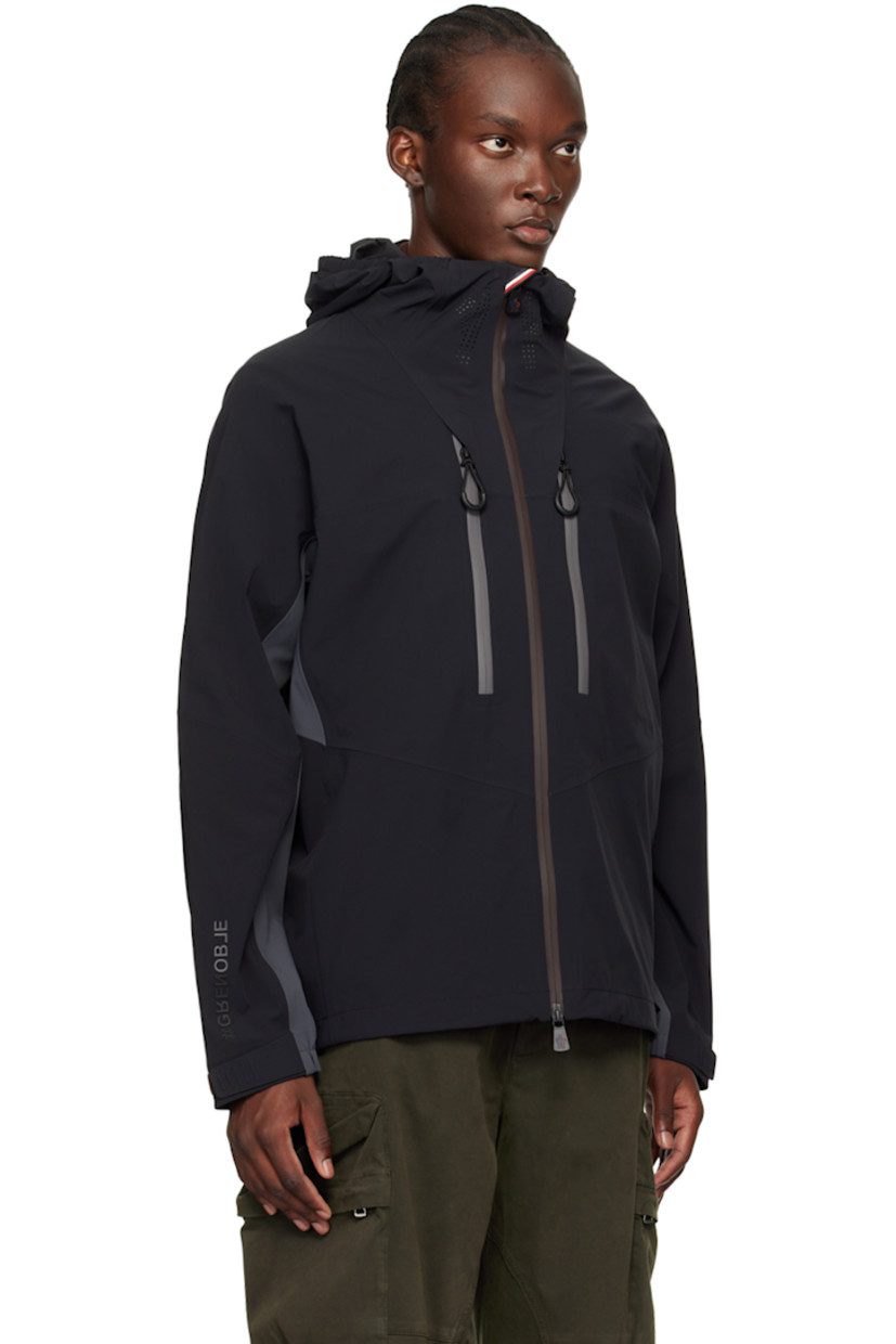 Paneled stretch nylon taffeta jacket. Taped seams throughout.

· Windproof, waterproof, lightweight, and breathable
· RECCO® rescue technology
· Reflective logo printed at elasticized brimmed hood
· Perforated logo at funnel neck 
· Logo bonded at two-way zip closure and cuff
· Zip pockets
· Bungee-style drawstring at hem 
· Yoke sleeves
· Embroidered logo patch at sleeve
· Velcro tab at partially elasticized cuffs
· Reflective perforated logo patch at back yoke
· Unlined 
· Logo-engraved black hardware

Supplier color: Black