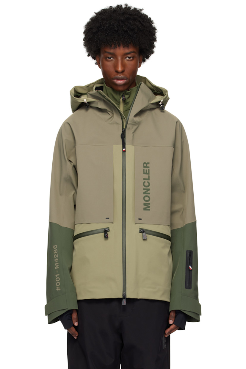 Stretch nylon taffeta jacket. Waterproof, windproof, lightweight, and breathable.

· RECCO® rescue reflector
· Heat-sealed seams throughout
· Bungee-style drawstring at hood
· Funnel neck
· Two-way zip closure
· Zip pockets
· Logo bonded at chest and back
· Bungee-style drawstring at hem
· Zip vent at sleeves
· Rubberized logo patch at sleeve
· Text bonded at sleeve
· Velcro tab at cuffs
· Thumbhole at inset jersey cuffs
· Zip pocket at interior
· Snow skirt at interior
· Partial taffeta lining

Supplier color: Khaki green