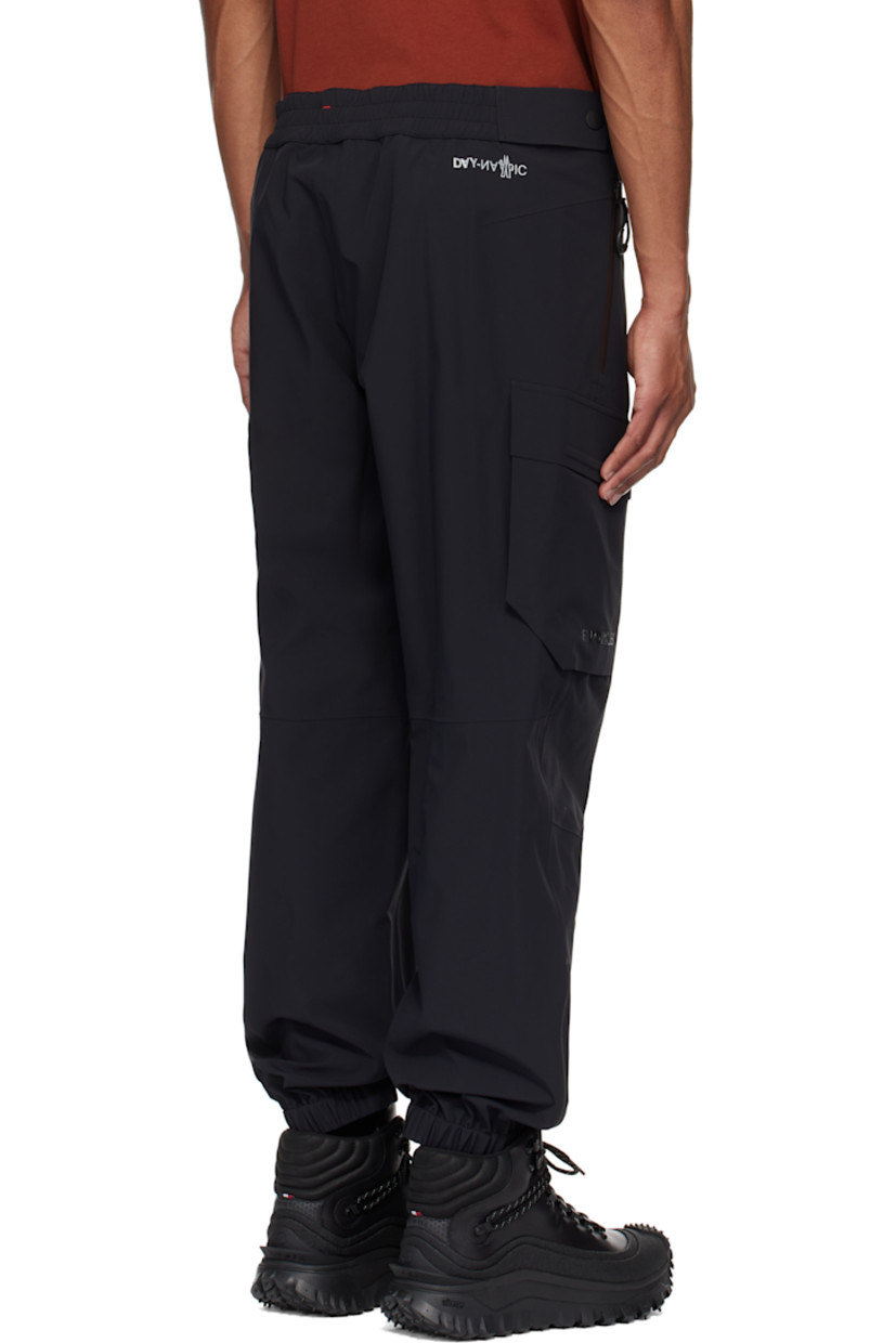 Plain-woven stretch nylon cargo pants. Lightweight, breathable, windproof, and waterproof.

· Adjustable press-stud tabs at partially elasticized waistband
· Two-pocket styling
· Zip-fly
· Creased legs
· Elasticized cuffs
· Cargo pocket and darts at outseams
· Rubberized logo appliqué at pocket
· Reflective logo printed at back waist

Part of the Day-Namic collection.

Supplier color: Black