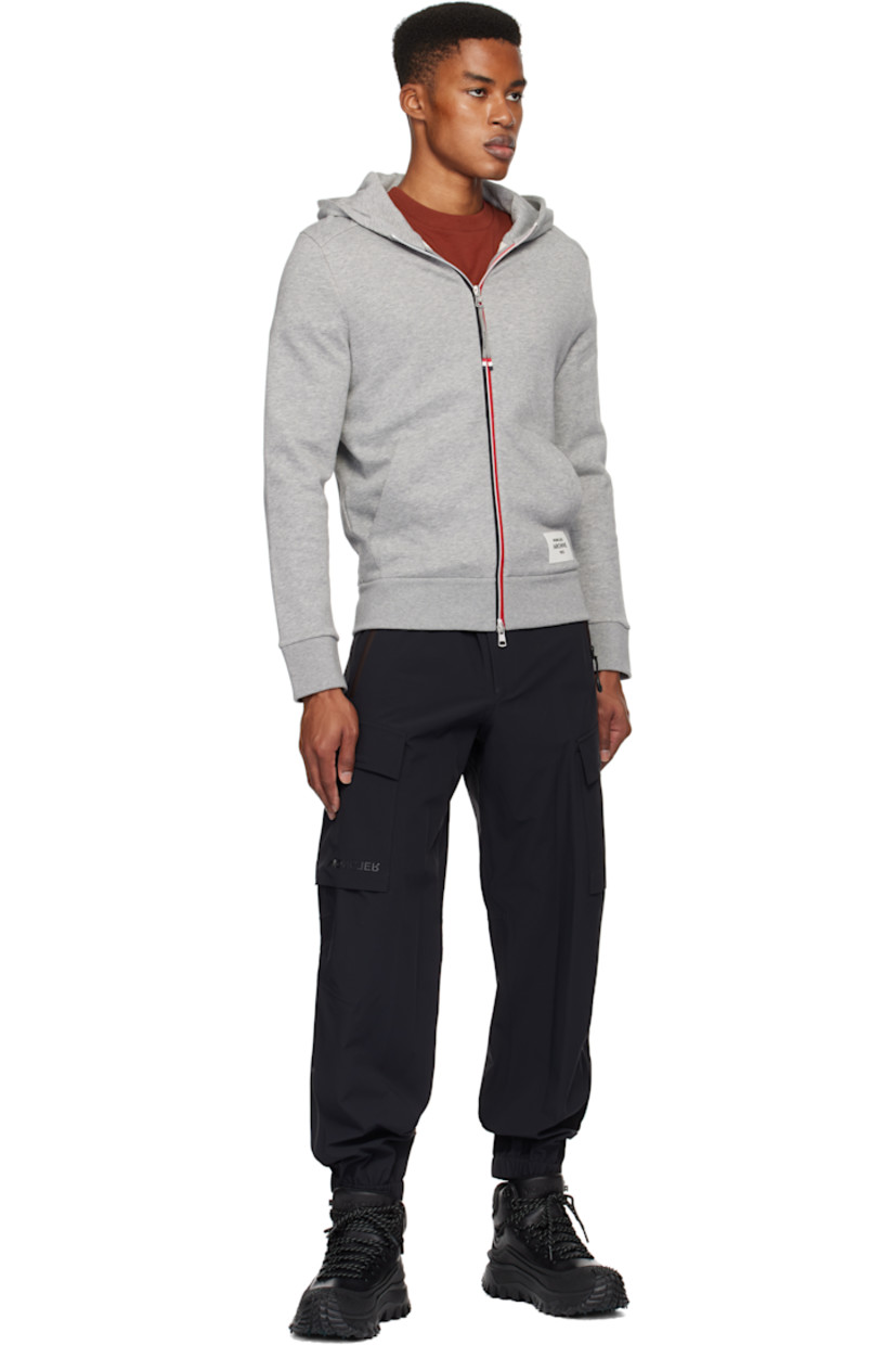 Plain-woven stretch nylon cargo pants. Lightweight, breathable, windproof, and waterproof.

· Adjustable press-stud tabs at partially elasticized waistband
· Two-pocket styling
· Zip-fly
· Creased legs
· Elasticized cuffs
· Cargo pocket and darts at outseams
· Rubberized logo appliqué at pocket
· Reflective logo printed at back waist

Part of the Day-Namic collection.

Supplier color: Black