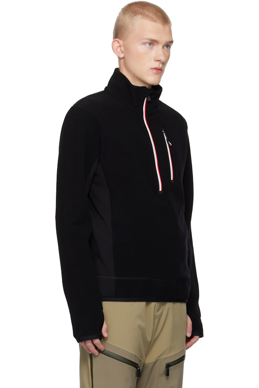 Insulated stretch polyester fleece jacket. Windproof, water-repellent, breathable, and lightweight.

· Stand collar
· Half-zip closure
· Zip pocket 
· Elasticized hem and cuffs
· Embroidered logo patch at sleeve
· Thumbhole at cuffs

Supplier color: Black
