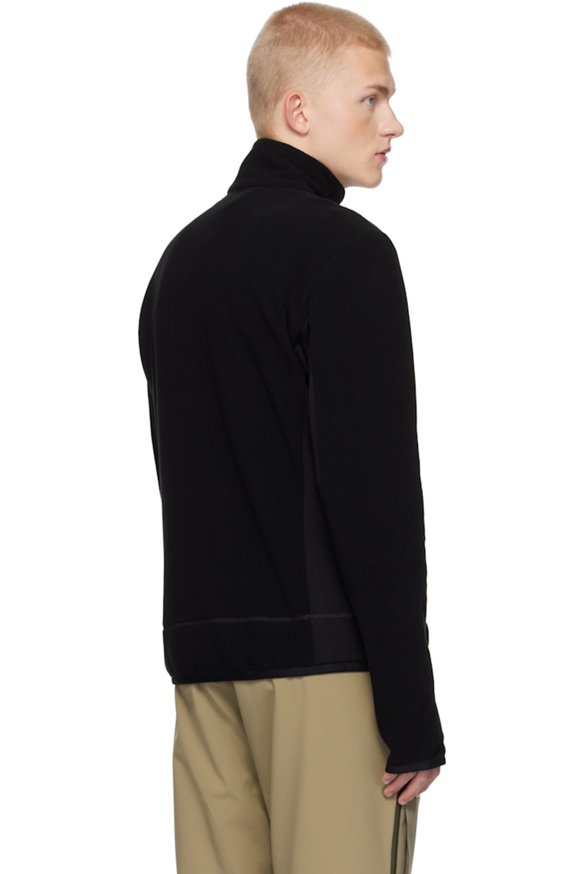 Insulated stretch polyester fleece jacket. Windproof, water-repellent, breathable, and lightweight.

· Stand collar
· Half-zip closure
· Zip pocket 
· Elasticized hem and cuffs
· Embroidered logo patch at sleeve
· Thumbhole at cuffs

Supplier color: Black