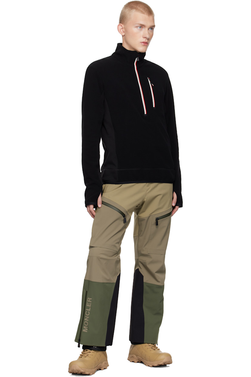 Insulated stretch polyester fleece jacket. Windproof, water-repellent, breathable, and lightweight.

· Stand collar
· Half-zip closure
· Zip pocket 
· Elasticized hem and cuffs
· Embroidered logo patch at sleeve
· Thumbhole at cuffs

Supplier color: Black