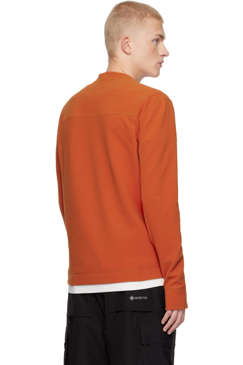 Insulated stretch polyester fleece sweatshirt. Windproof, water-repellent, breathable, and lightweight.

· Crewneck
· Embroidered logo patch at chest
· Thumbhole at cuffs

Supplier color: Orange