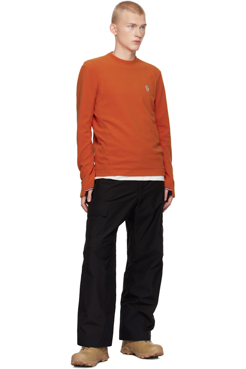 Insulated stretch polyester fleece sweatshirt. Windproof, water-repellent, breathable, and lightweight.

· Crewneck
· Embroidered logo patch at chest
· Thumbhole at cuffs

Supplier color: Orange