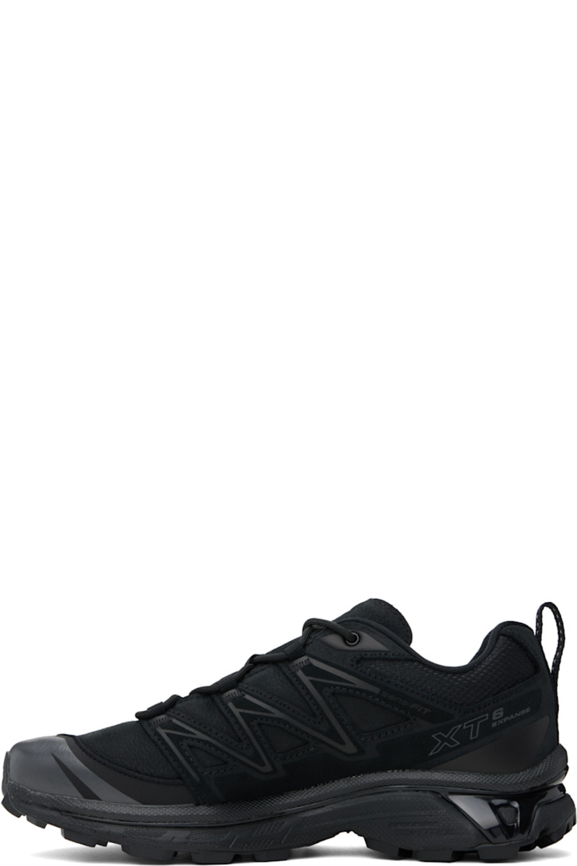 Low-top grained leather, mesh, and suede sneakers in black.

· SensiFit™ overlay and reflective trim throughout
· Lace-up closure
· Padded tongue and collar
· Logo embossed at outer side
· Webbing pull-loop at heel tab
· Jersey lining
· Molded OrthoLite® footbed
· Agile Chassis™ System rubber midsole
· Lugged Mud Contagrip® rubber sole

Supplier color: Black/Black/Asphalt