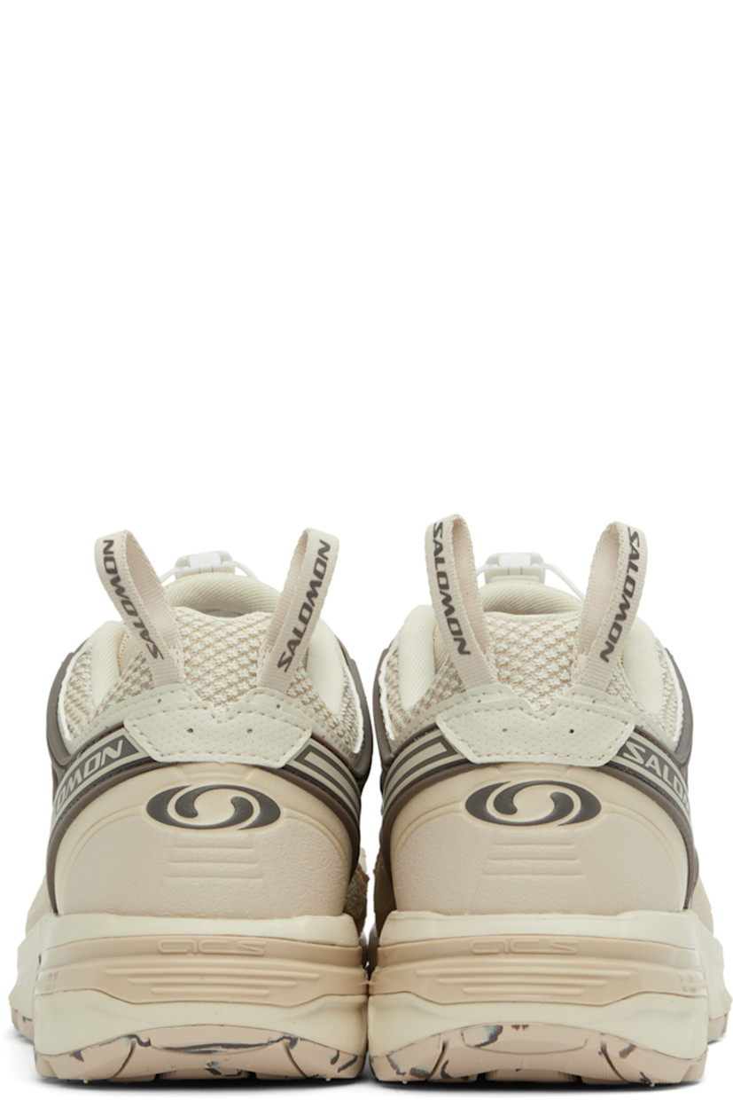 Low-top mesh and buffed faux-leather sneakers in beige.

· Rubberized trim throughout
· Logo printed at toe and outer side
· Quicklace™ closure
· Logo patch at padded tongue
· Padded collar
· Logo-bonded pull-loops at heel collar
· Molded OrthoLite® insole
· Jersey lining
· Agile Chassis™ System at foam rubber midsole
· Treaded Contagrip® rubber sole
· Logo-engraved gunmetal-tone hardware

Supplier color: Almond milk/Cement/Falcon