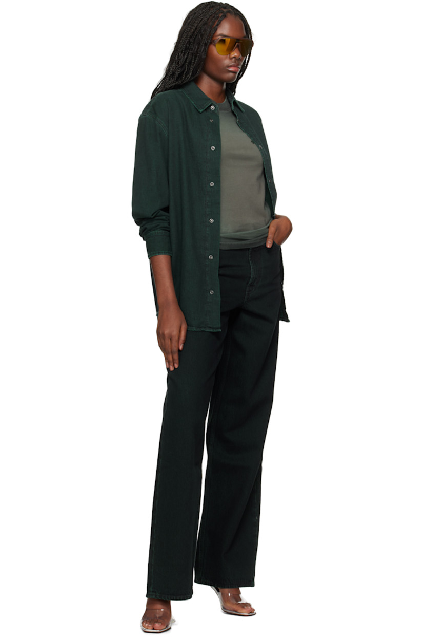 Overdyed non-stretch organic cotton denim shirt.

· Spread collar
· Press-stud closure
· Logo embroidered at front
· Shirttail hem
· Dropped shoulders
· Press-stud barrel cuffs
· Box pleat at back yoke
· Mother-of-pearl hardware

Supplier color: Overdyed sea green
