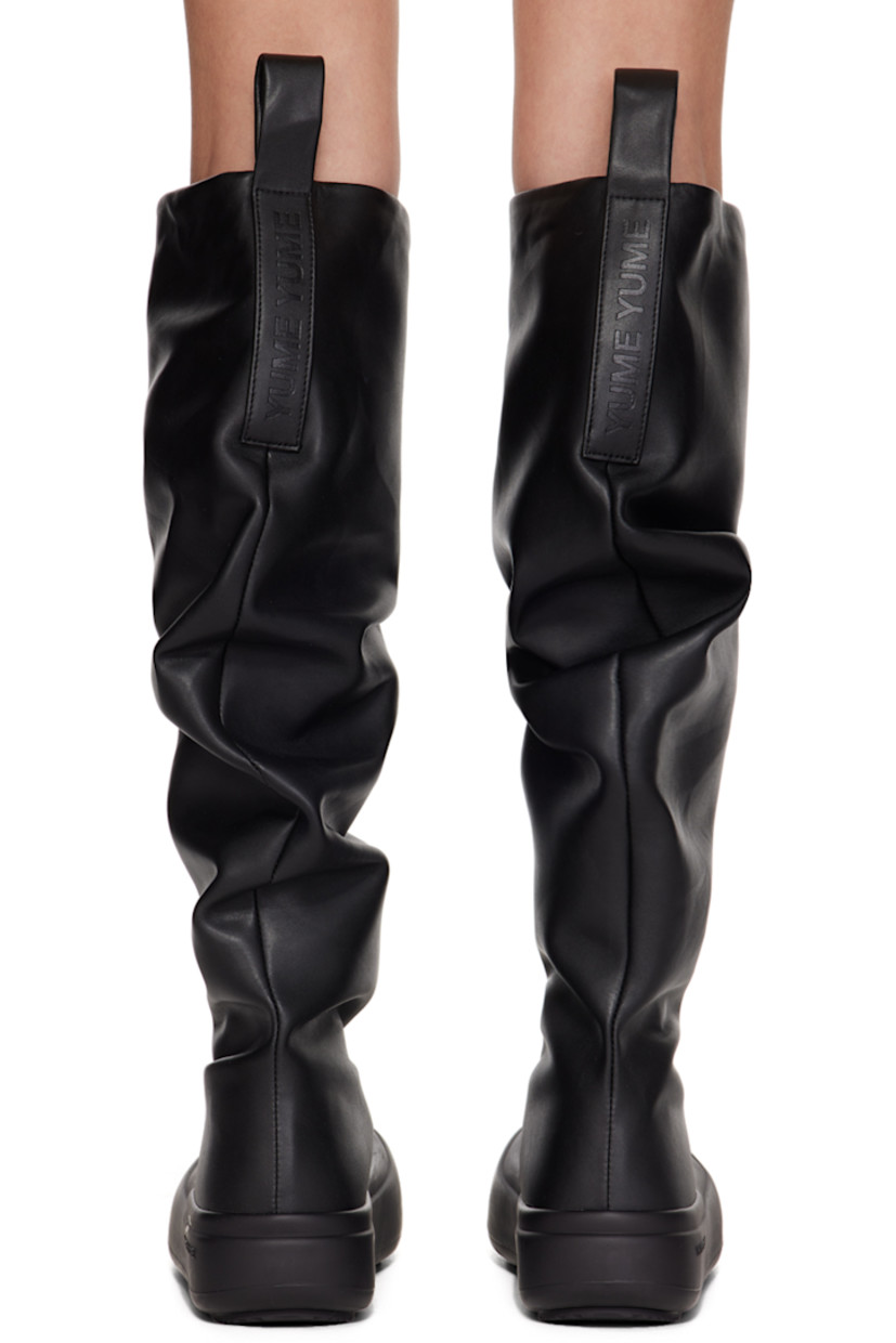 Knee-high buffed faux-leather slip-on boots in black. 

· Gathering throughout
· Rubber cap toe
· Logo-embossed pull-loops at collar
· Buffed faux-leather lining
· Logo embossed at outer midsole
· Treaded recycled rubber sole

Supplier color: Black