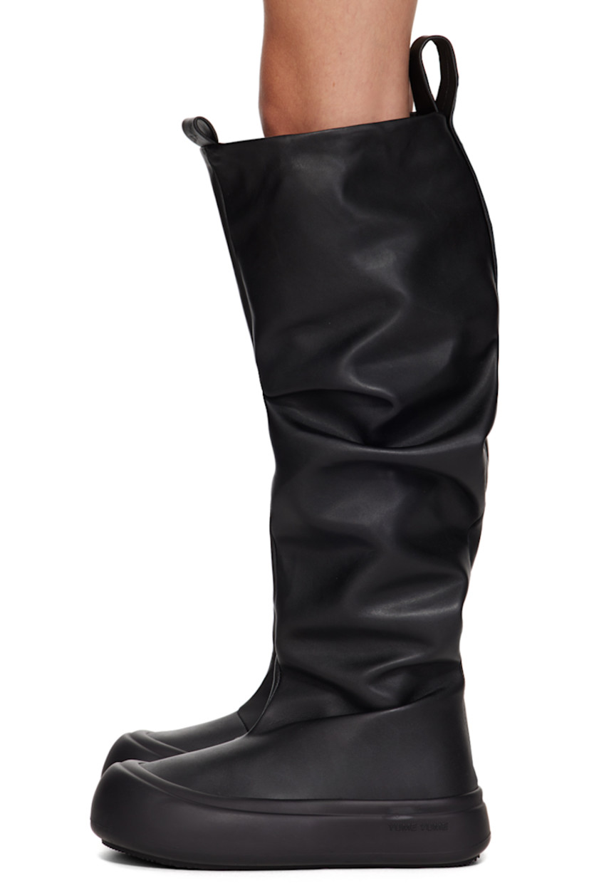 Knee-high buffed faux-leather slip-on boots in black. 

· Gathering throughout
· Rubber cap toe
· Logo-embossed pull-loops at collar
· Buffed faux-leather lining
· Logo embossed at outer midsole
· Treaded recycled rubber sole

Supplier color: Black