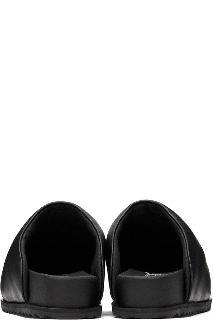 Buffed leather slip-on loafers in black.

· Square toe
· Logo stamp at molded footbed
· Treaded TPU sole

Supplier color: Black leather