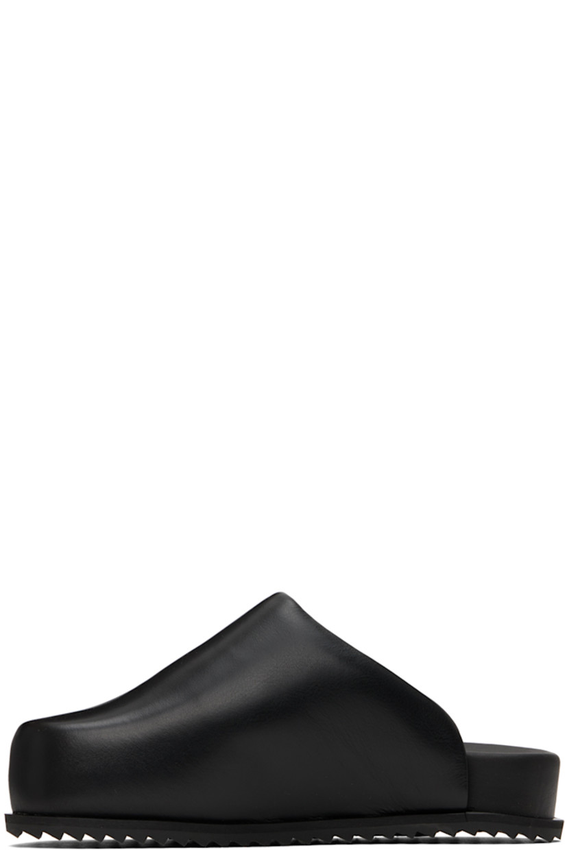 Buffed leather slip-on loafers in black.

· Square toe
· Logo stamp at molded footbed
· Treaded TPU sole

Supplier color: Black leather