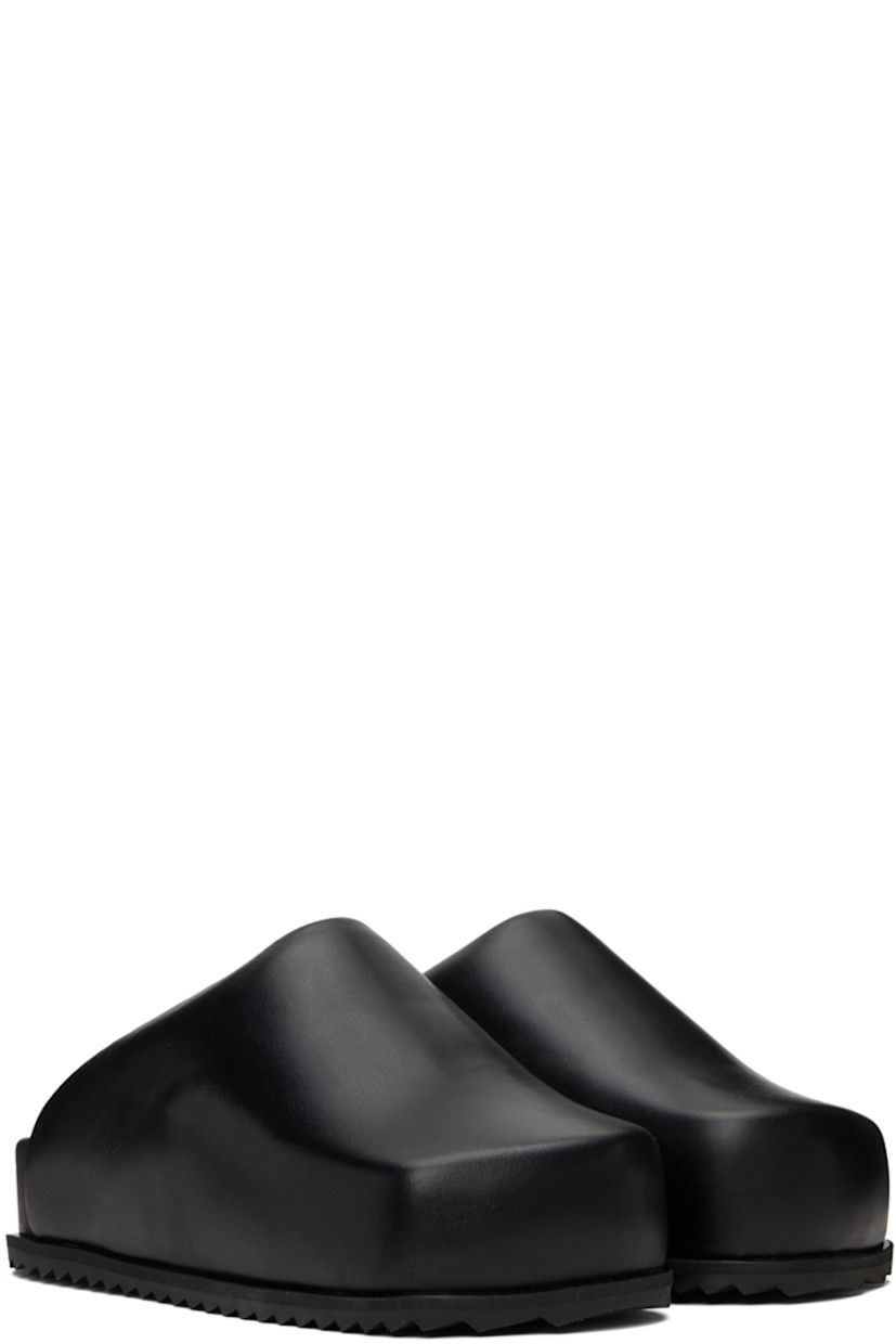Buffed leather slip-on loafers in black.

· Square toe
· Logo stamp at molded footbed
· Treaded TPU sole

Supplier color: Black leather
