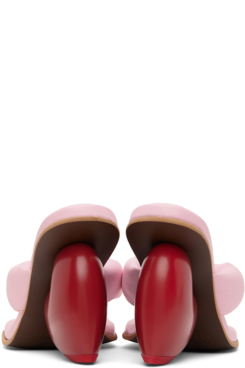 Padded buffed faux-leather mules in pink and red.

· Open square toe
· Thong-style strap at vamp
· Logo embossed at padded footbed
· Sculptural heel with rubber injection
· Treaded rubber sole
· Heel: H3.25"

Supplier color: Candy/Red