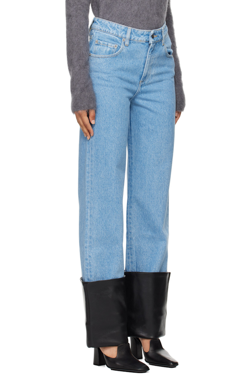 Straight-leg non-stretch denim jeans. Fading throughout. 

· Belt loops
· Five-pocket styling
· Zip-fly
· Rolled vegan leather trim at cuffs
· Logo patch at back waistband 
· Logo embroidered at back pockets 
· Logo-engraved silver-tone hardware
· Contrast stitching in beige 

Supplier color: Mid blue/Black