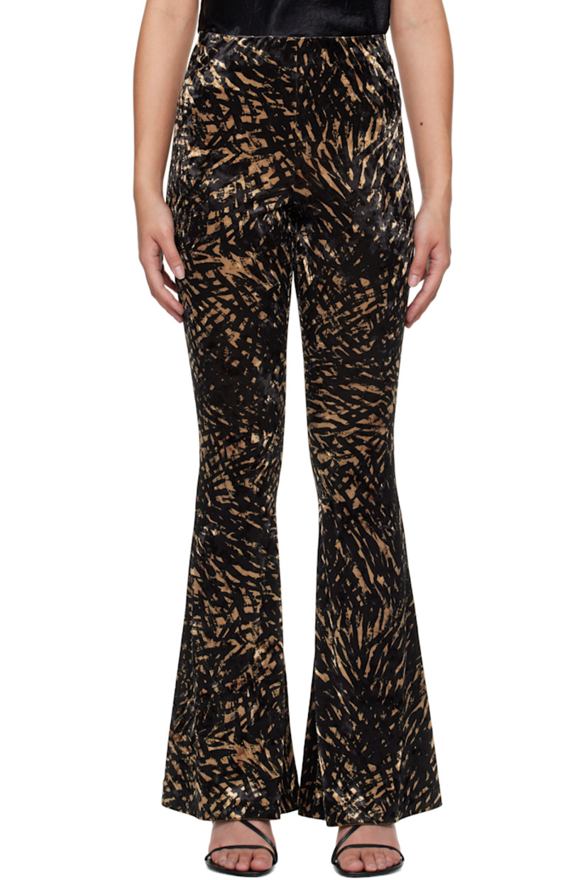 Stretch polyester crushed velvet leggings. Graphic pattern throughout.

· High-rise
· Elasticized waistband
· Flared cuffs

Supplier color: Fur stroke animal
