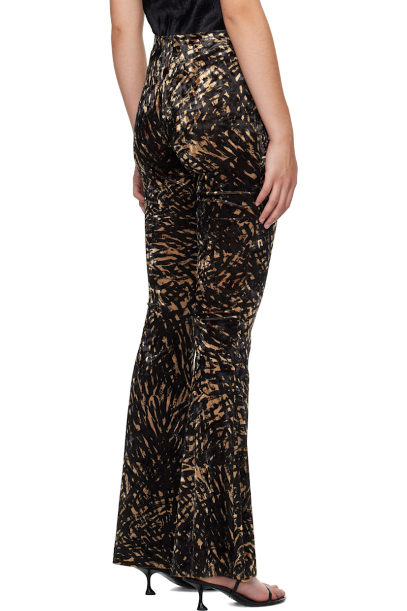 Stretch polyester crushed velvet leggings. Graphic pattern throughout.

· High-rise
· Elasticized waistband
· Flared cuffs

Supplier color: Fur stroke animal